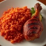 Jollof rice with grilled chicken drumstick