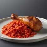 Jollof rice with grilled chicken drumstick