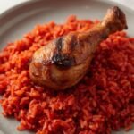 Jollof rice with grilled chicken drumstick