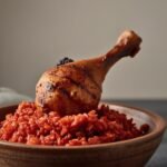 Jollof rice with grilled chicken drumstick